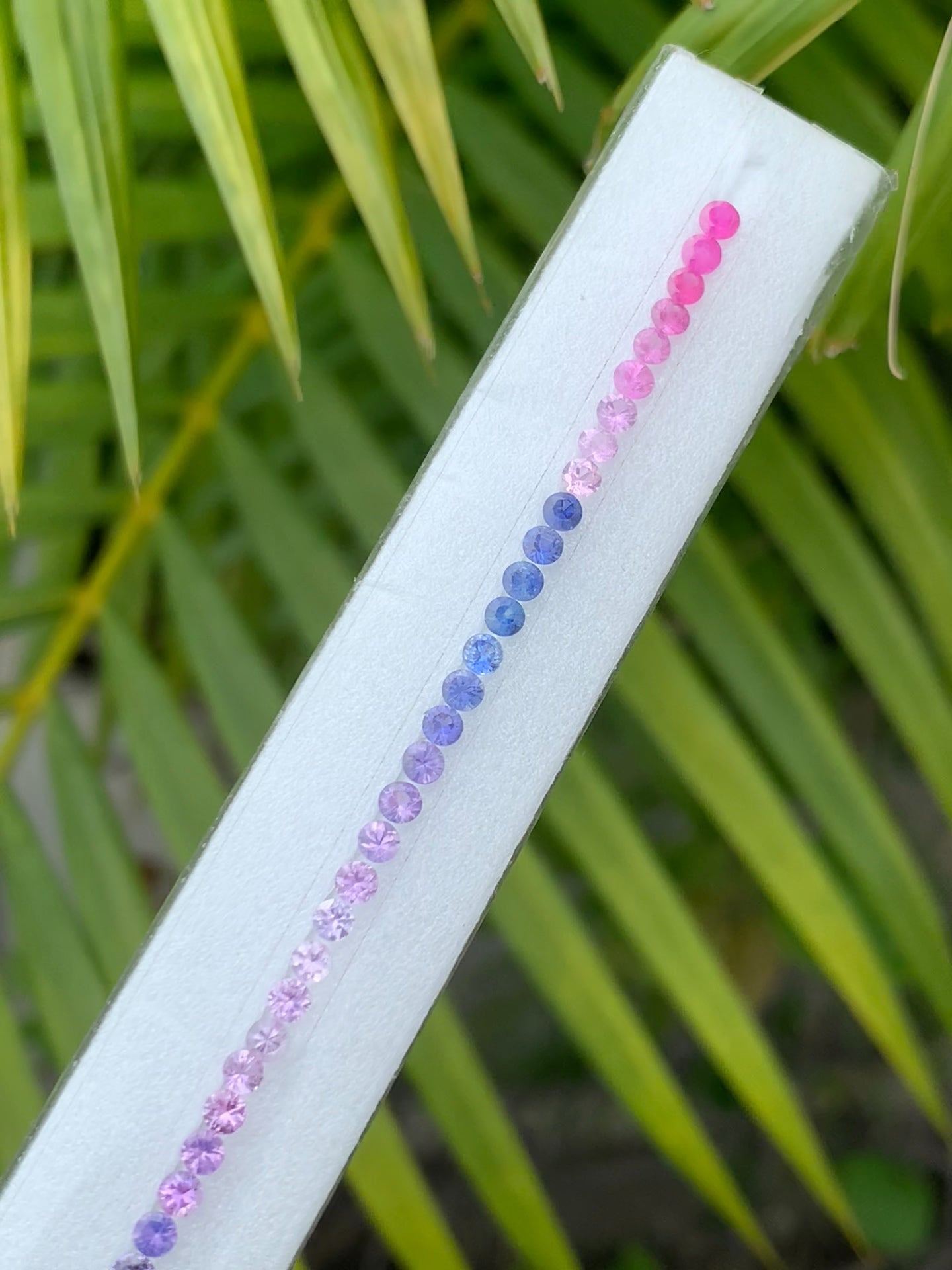 Natural fancy sapphire round cut strand 2.8mm calibrated close up
