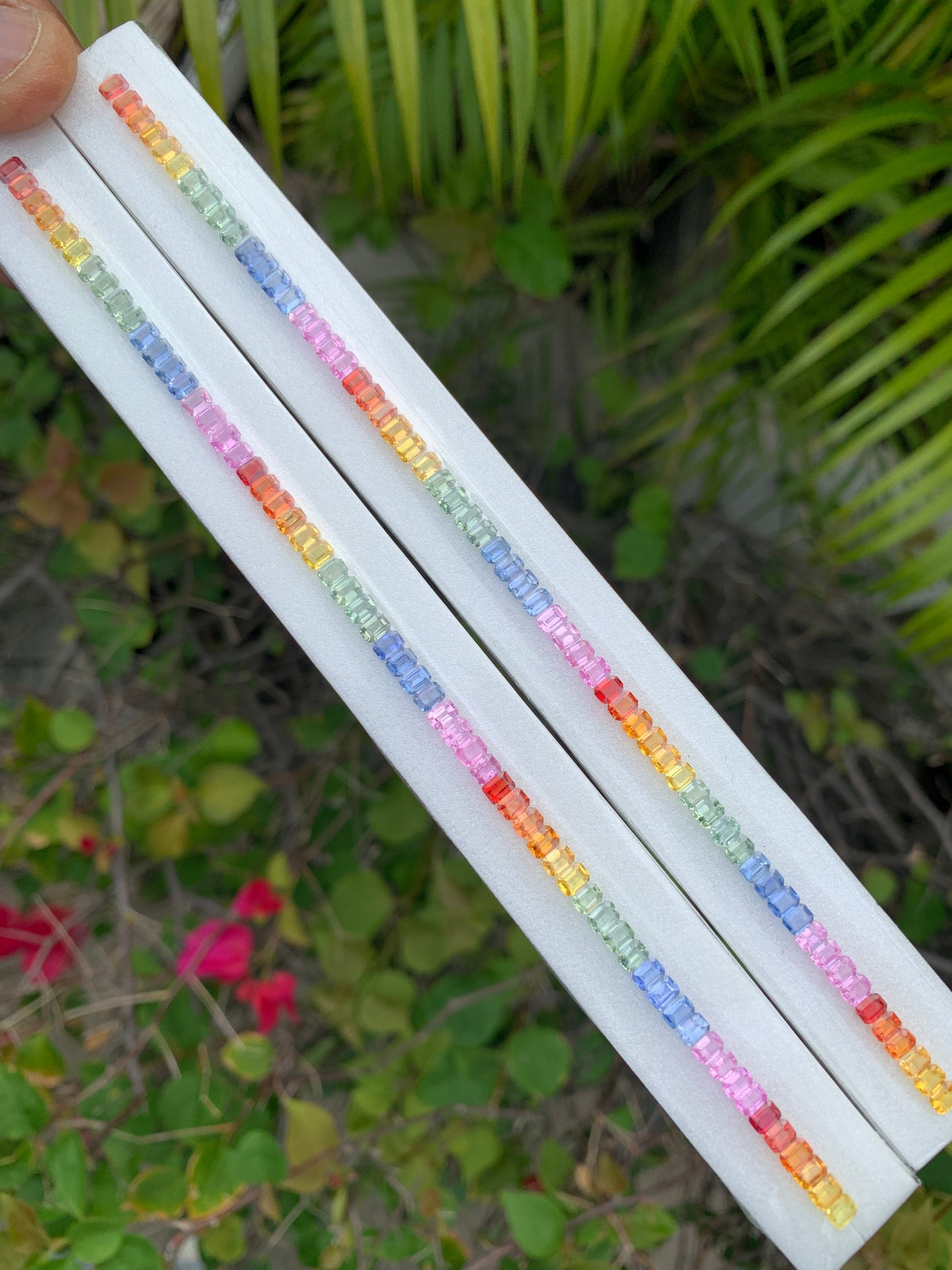 Heated African rainbow sapphire calibrated 4x3mm emerald cut single line strand