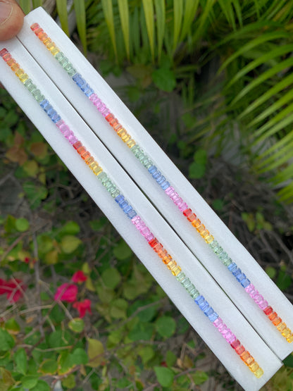 Heated African rainbow sapphire calibrated 4x3mm emerald cut single line strand