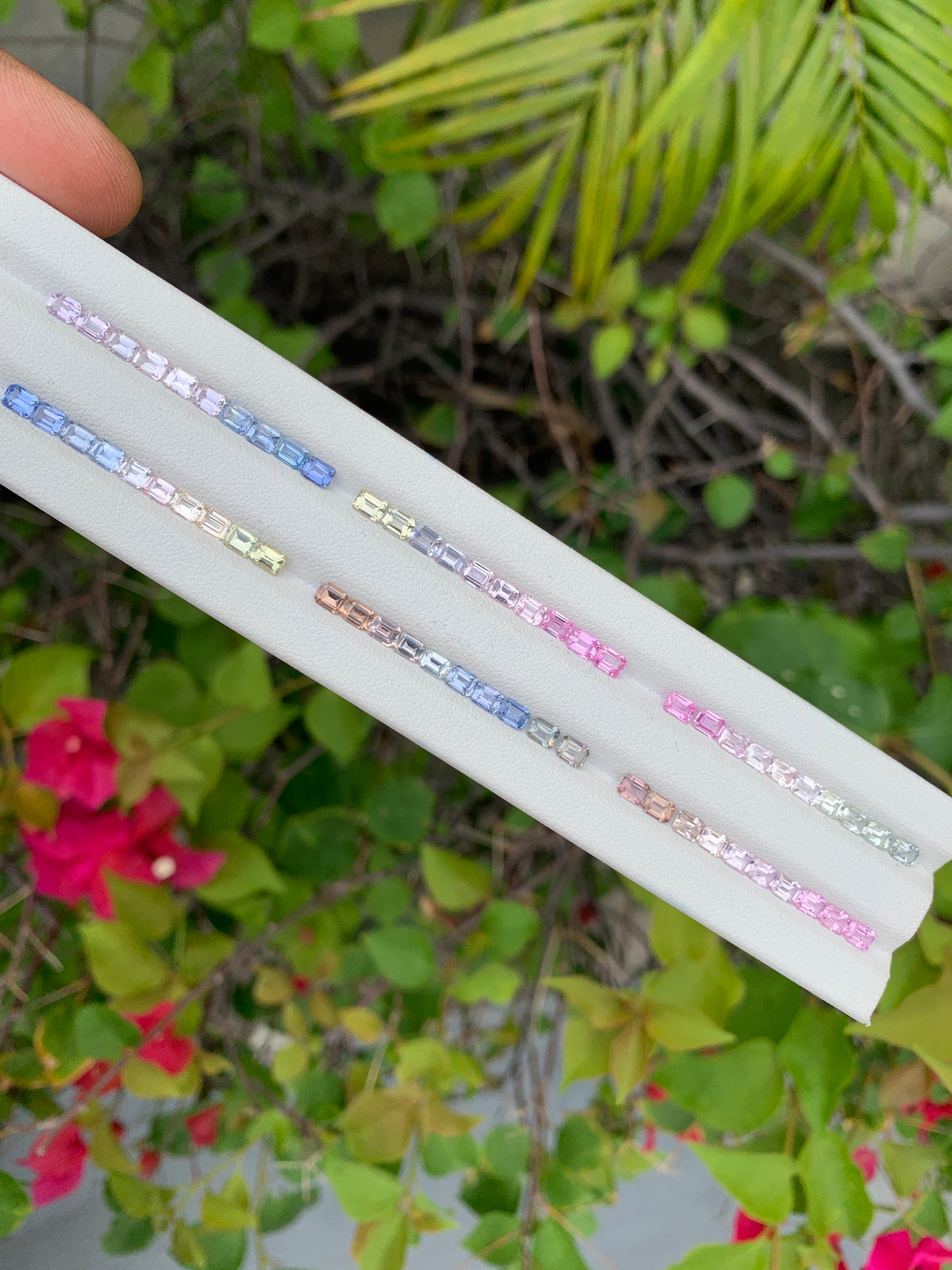 Pastel sapphire emerald cut gemstone set close up multi-color gradient for ring