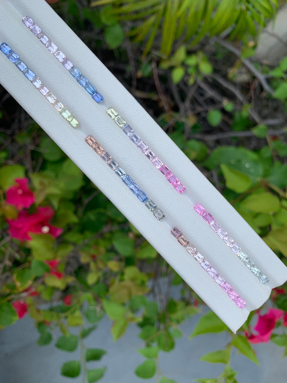 Six matched pastel sapphire emerald cut sets A-F labeled 4x3mm 10 pieces each